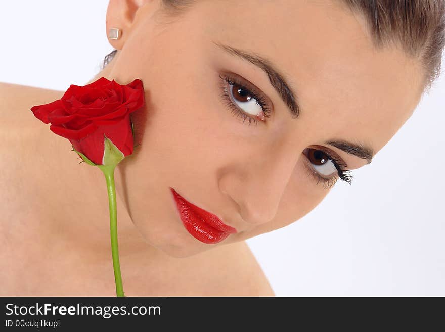 Isolated portrait of beauty with rose