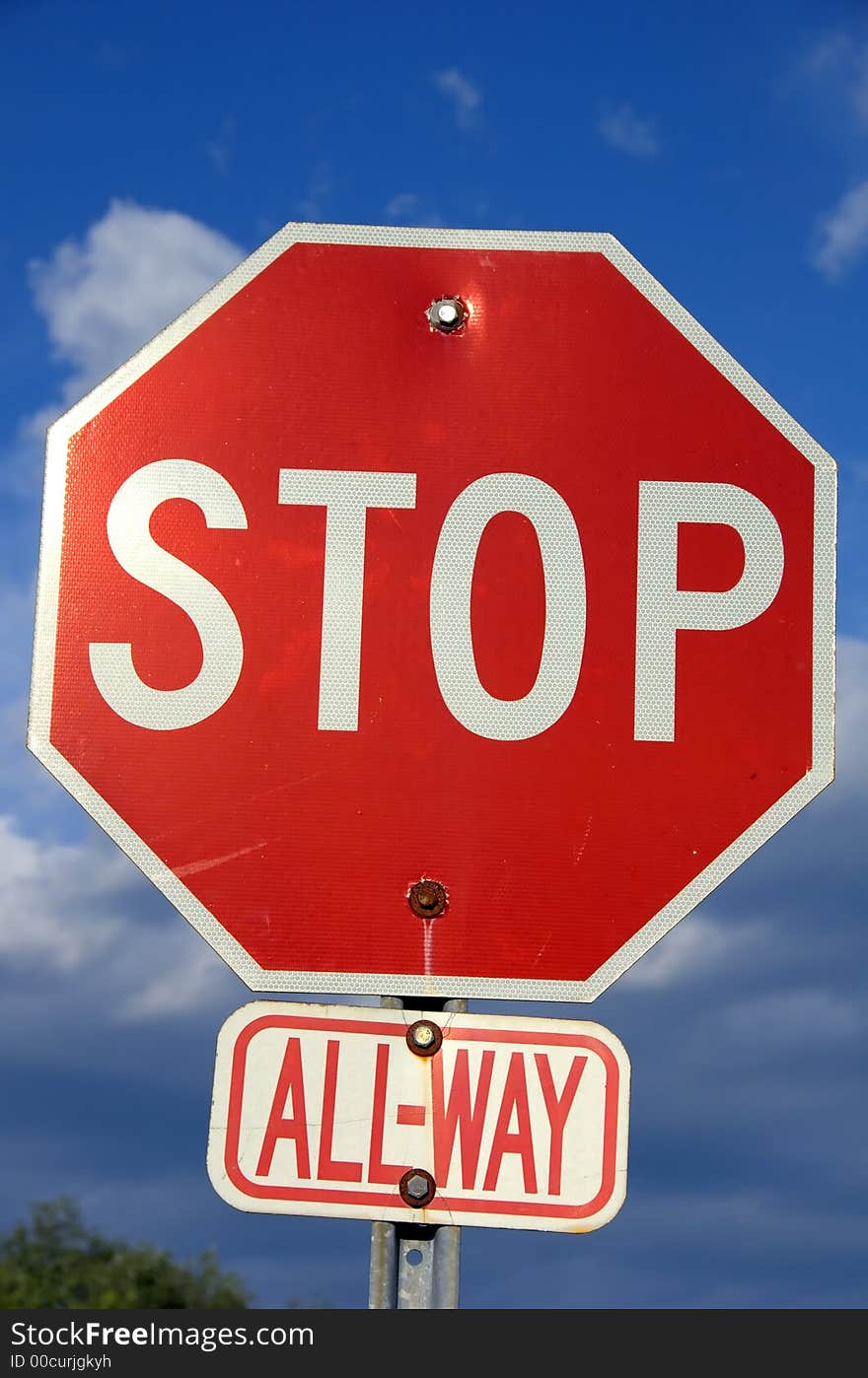 Street Stop Sign against a blue sky