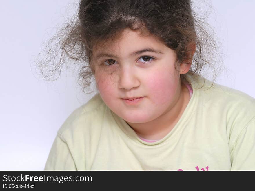 Portrait of little girl against white background