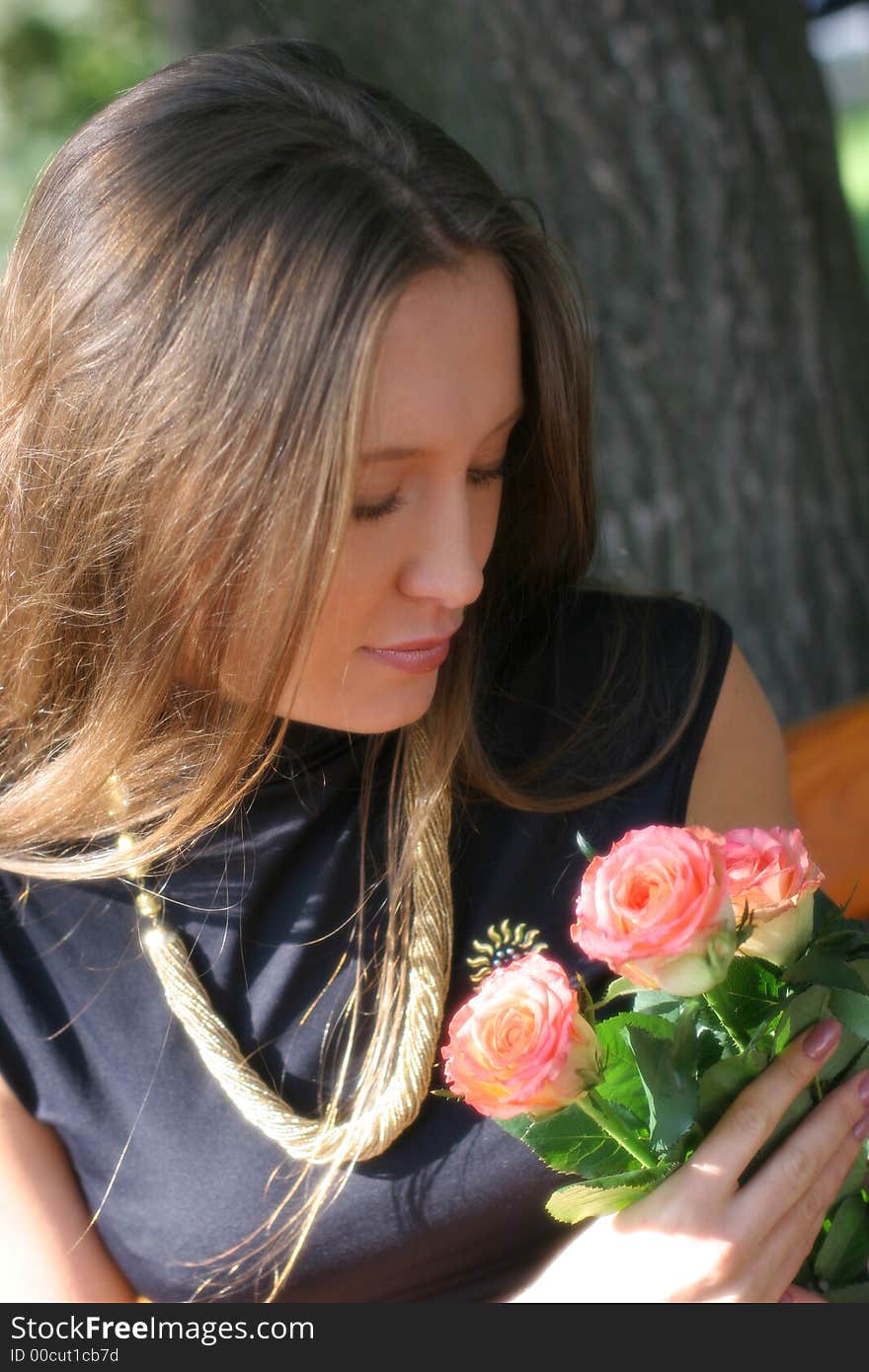 Girl with roses in park