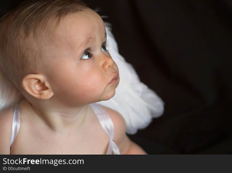 Image of baby wearing angel wings. Image of baby wearing angel wings