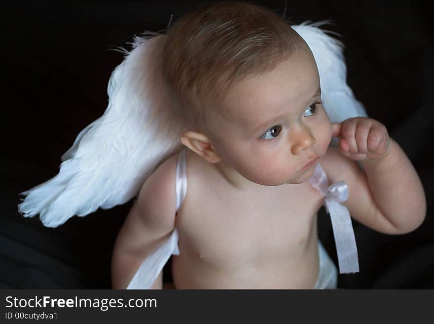 Image of baby wearing angel wings. Image of baby wearing angel wings