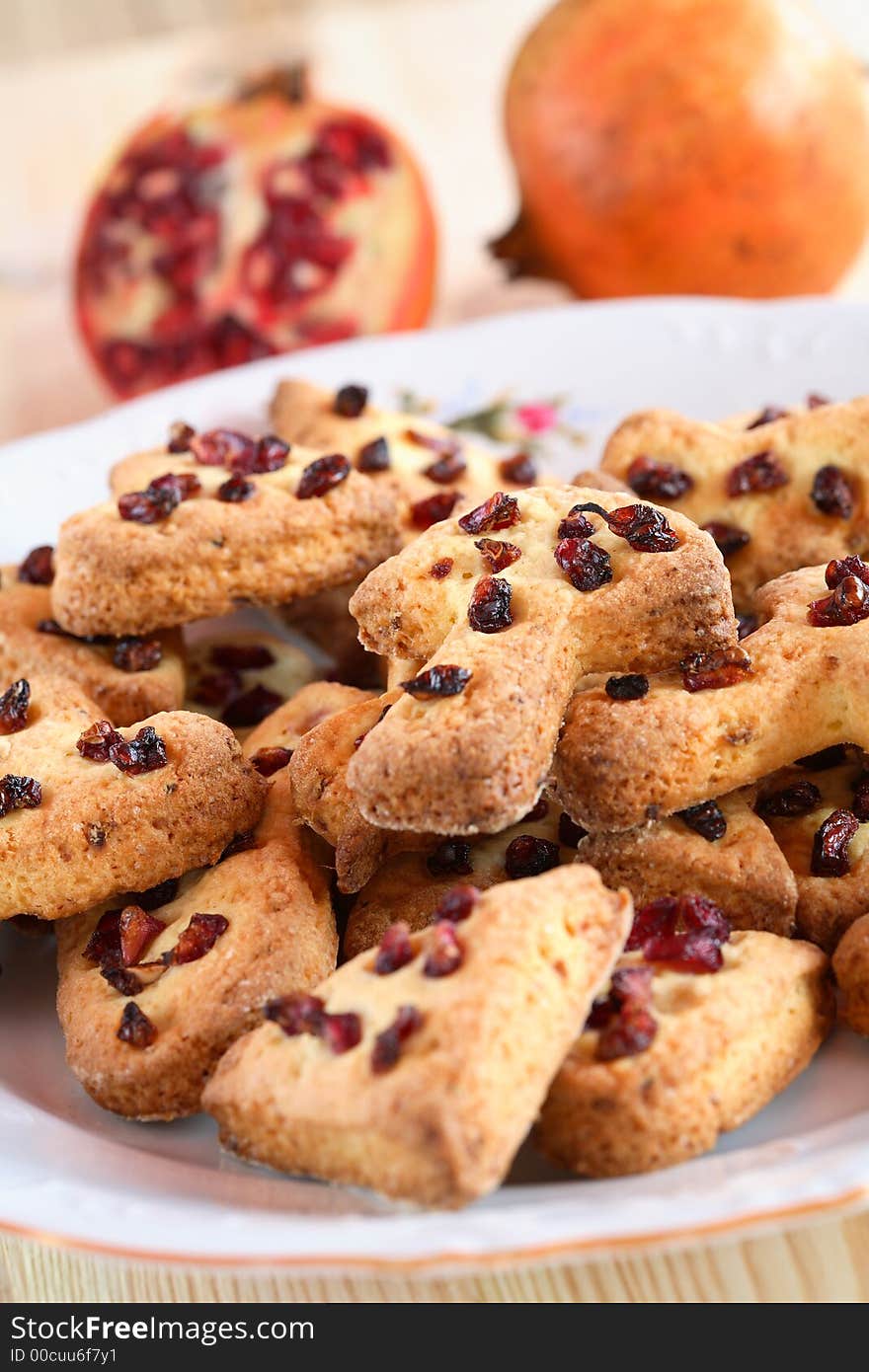 Tasty cake with pomegranate and ginger on the plate