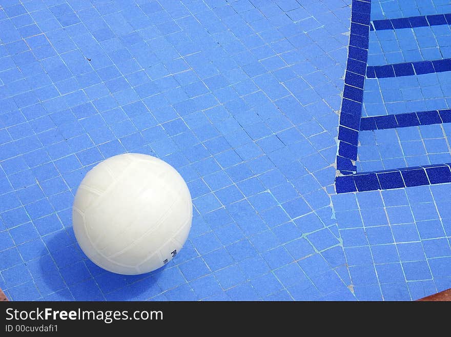 Volley ball in a swimming pool with blue mosaics. Volley ball in a swimming pool with blue mosaics