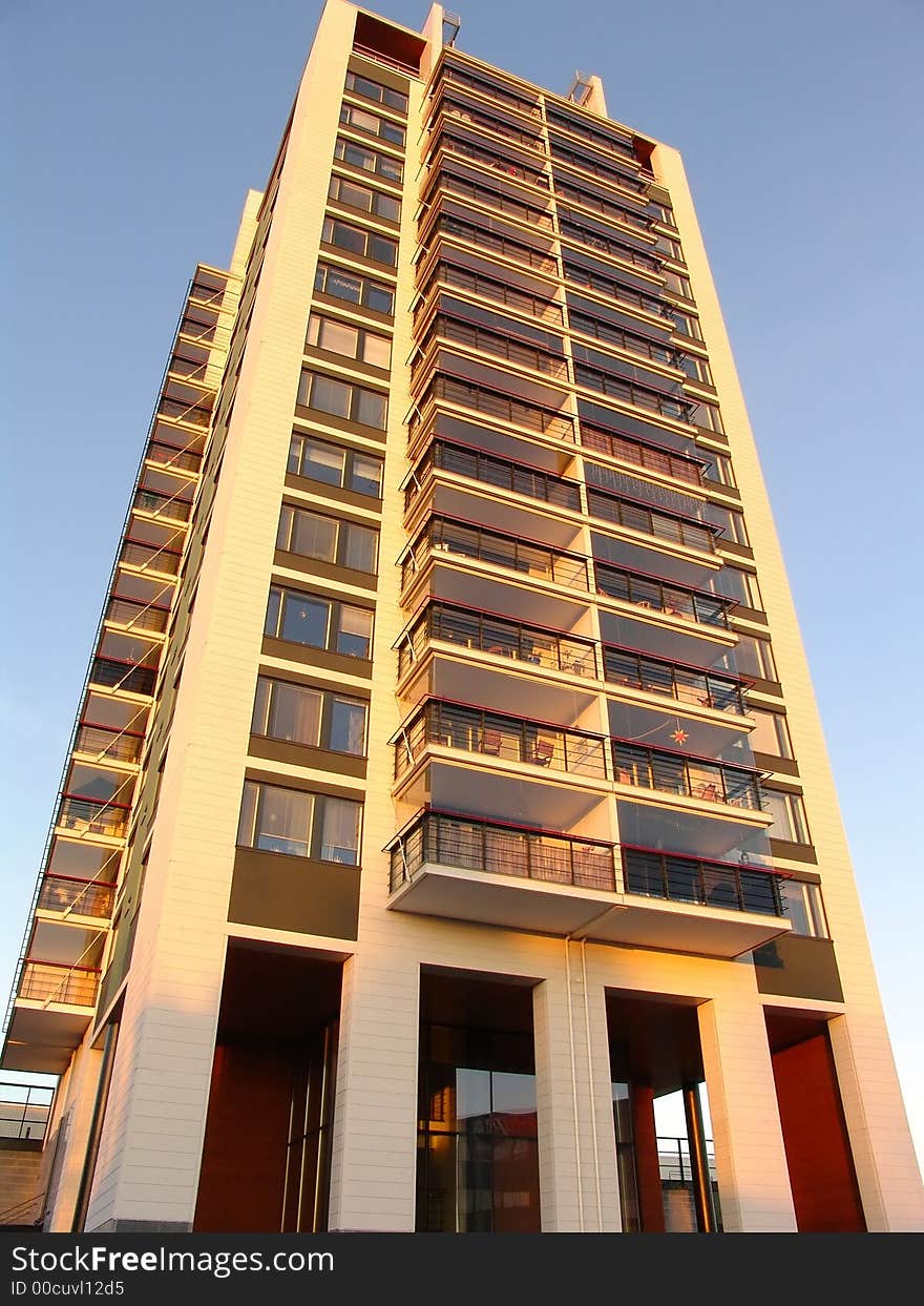 Big building on the blue sky background. Big building on the blue sky background