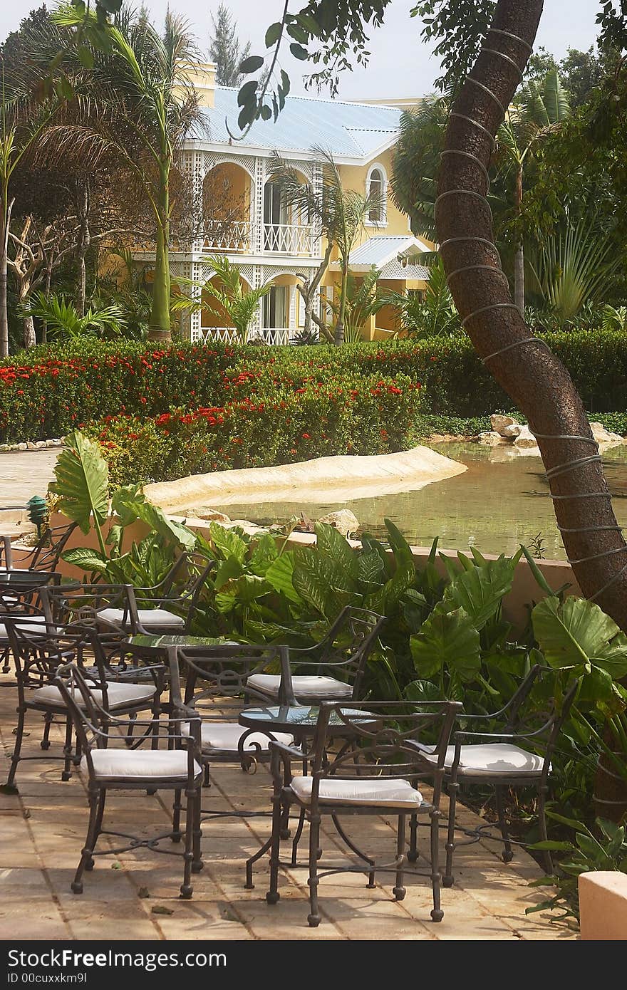 Garden with chairs of a hotel with hacienda like details in Cancun, Riviera Maya, Quinatan Roo, Mexico, Latin America