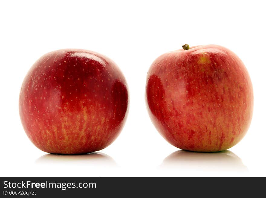 Red apples over white background