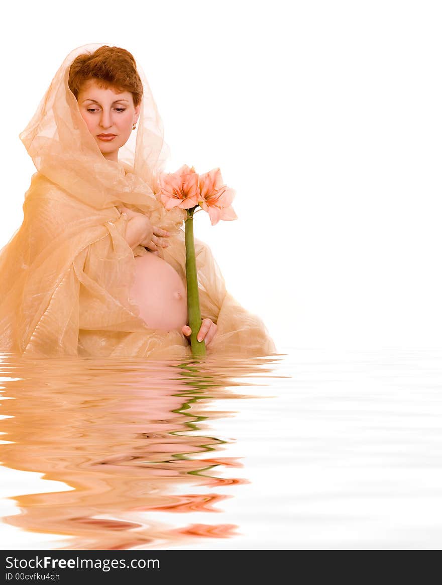 Beautiful young pregnant woman with flower in rendered water