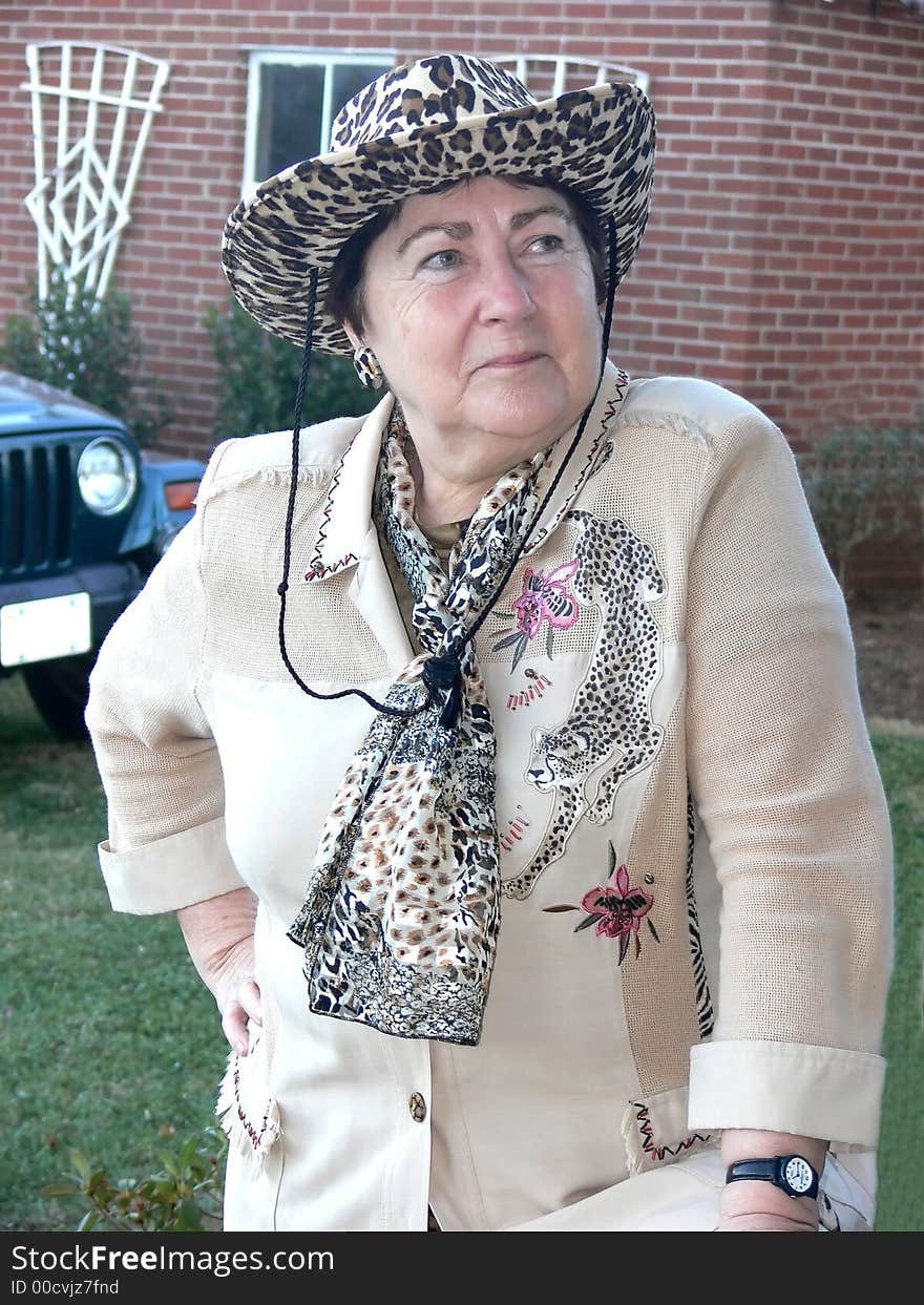 A senior citizen lady in the countryside all dressed up. A senior citizen lady in the countryside all dressed up.