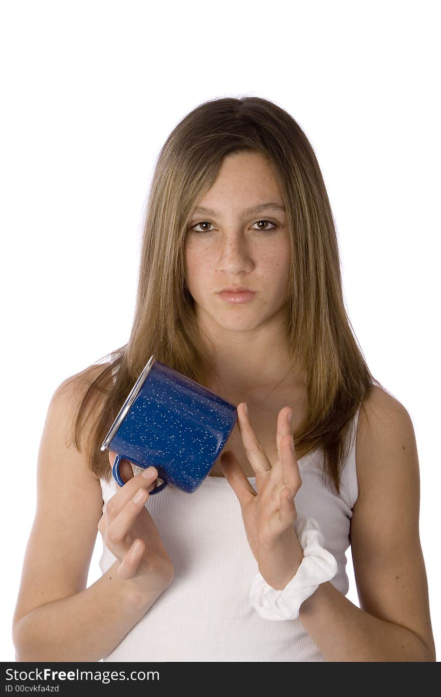 Teenage girl holding a coffee mug and drumming her fingers on it. Teenage girl holding a coffee mug and drumming her fingers on it