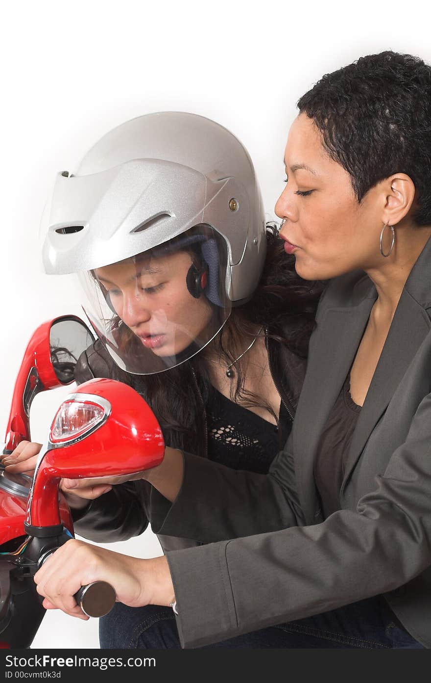 Couple girls talking on  scooter