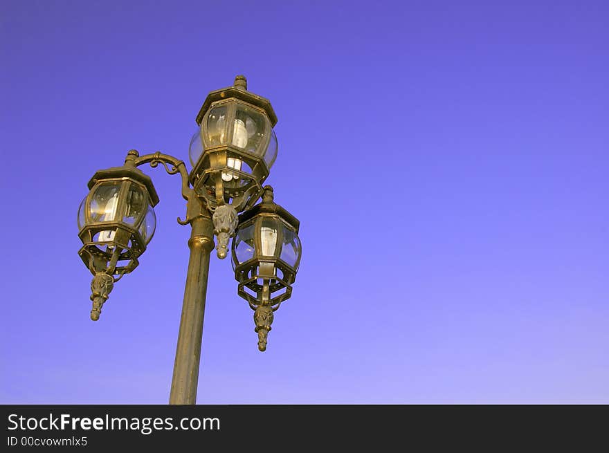 Lamp post under the blue sky