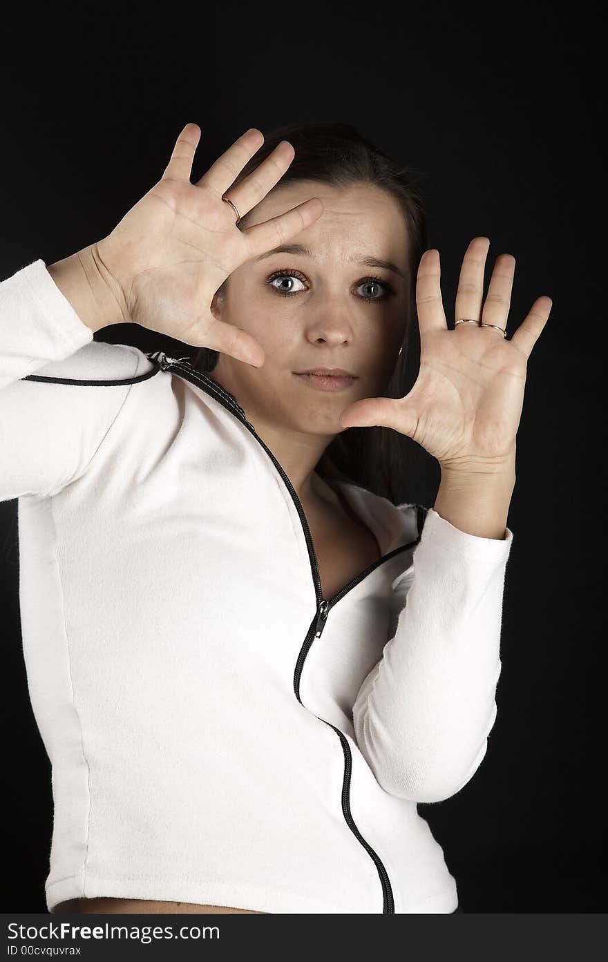 Girl, raised her hands with fright, on black background. Girl, raised her hands with fright, on black background