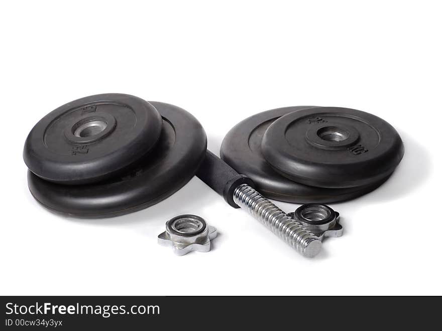 Completely disassembled black rubber dumbbell over white background. Completely disassembled black rubber dumbbell over white background