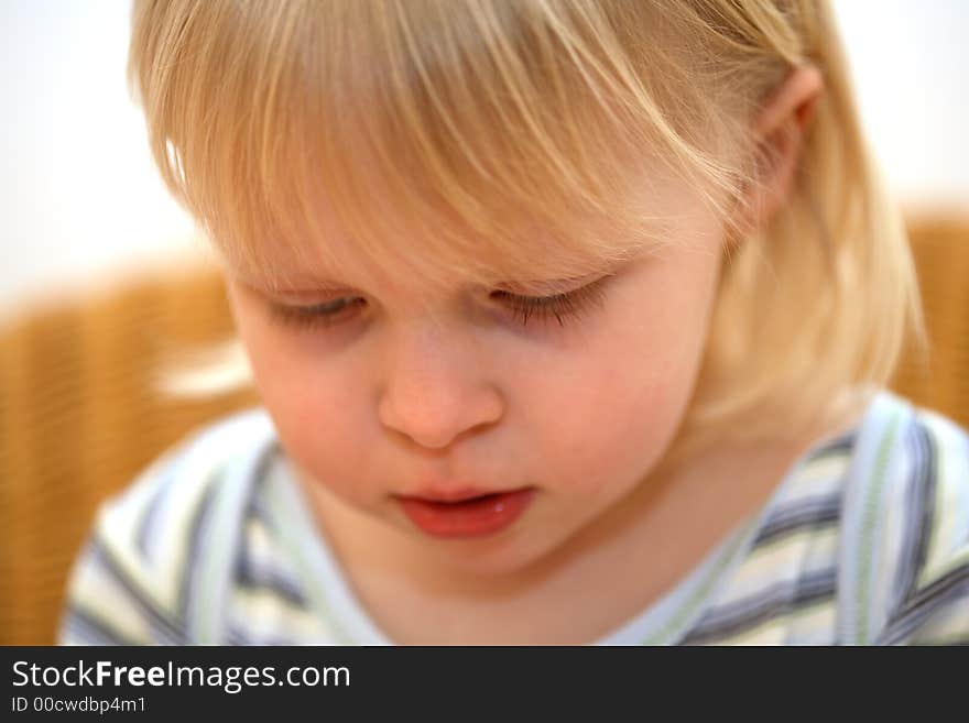 Face of a little girl and a white background