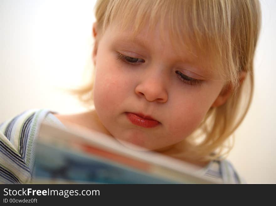 Face of a little girl and a white background