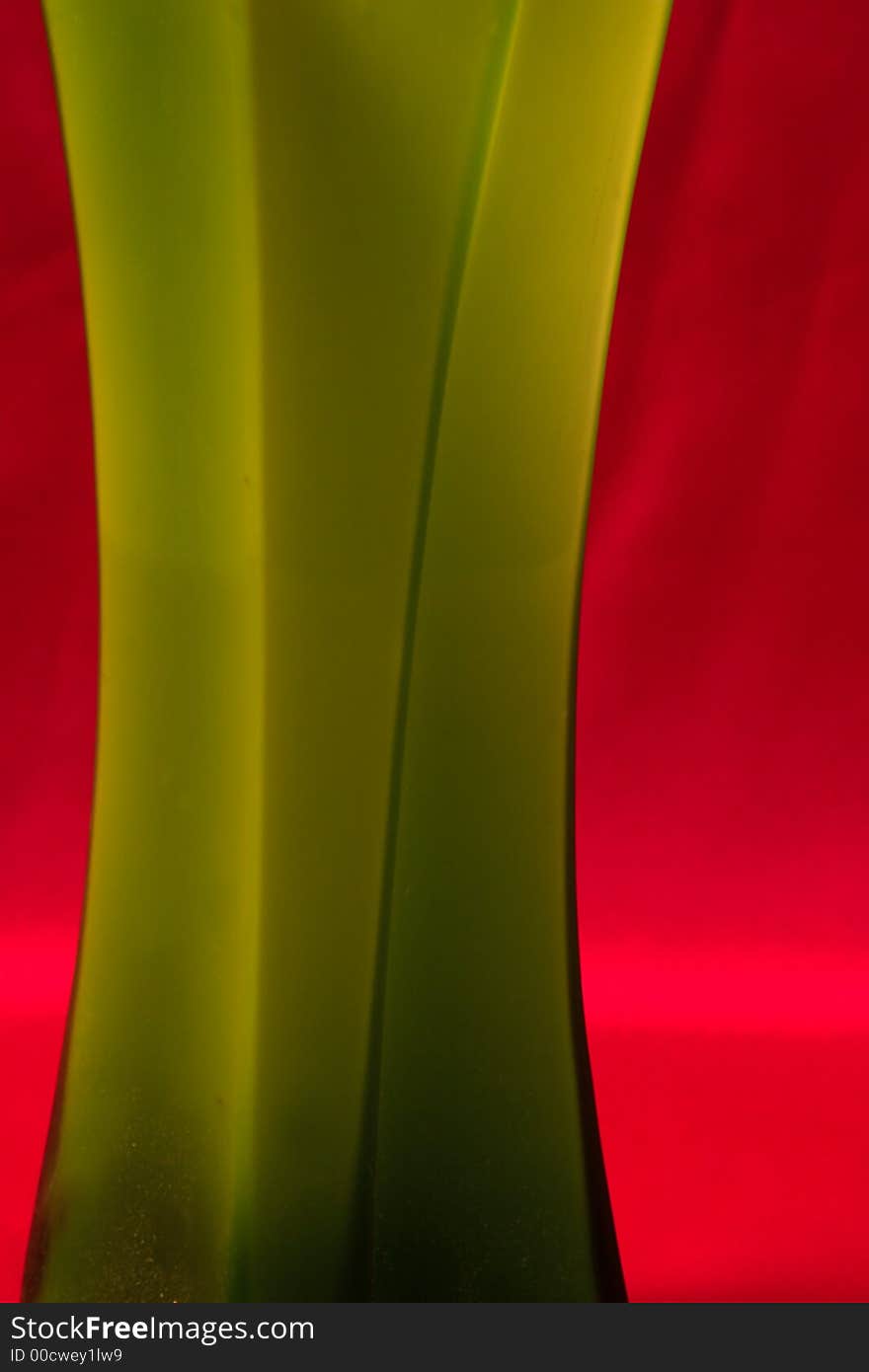 Green abstract shape over red background. Green abstract shape over red background