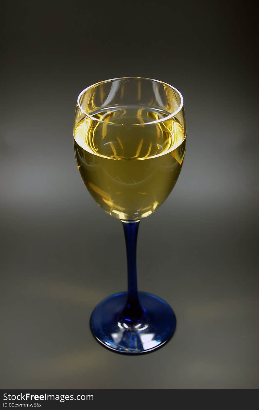 Wineglass with blue stem and chardonnay