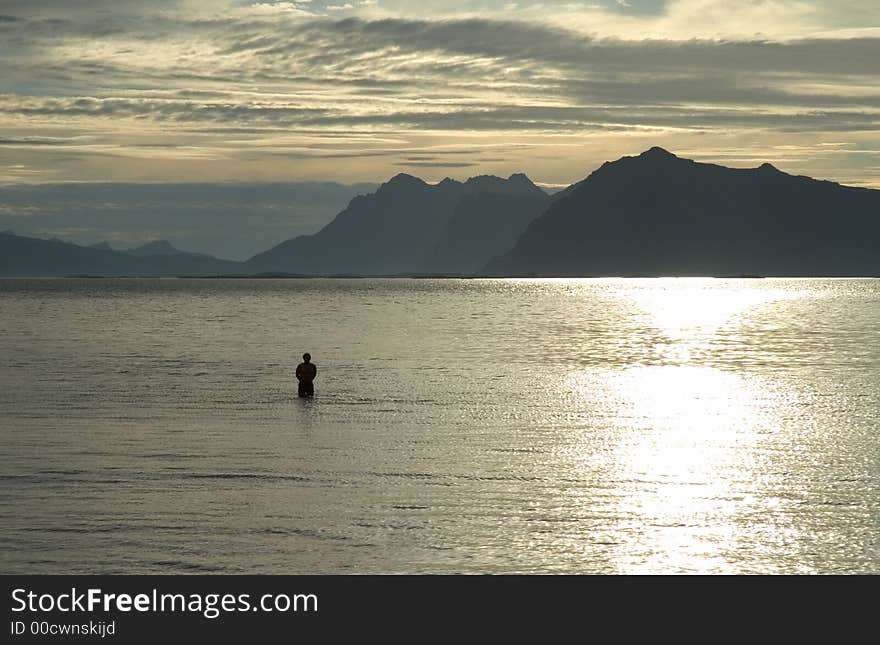 Bathing at sundown in lofoten, norway. Bathing at sundown in lofoten, norway