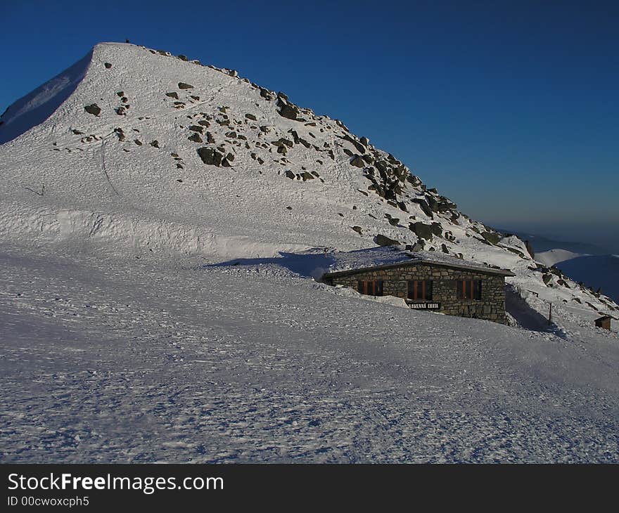 Kamenna chata  chalet by sunset