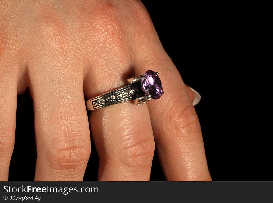 The ring closeup on the female arm, tungsten lighting used. The ring closeup on the female arm, tungsten lighting used