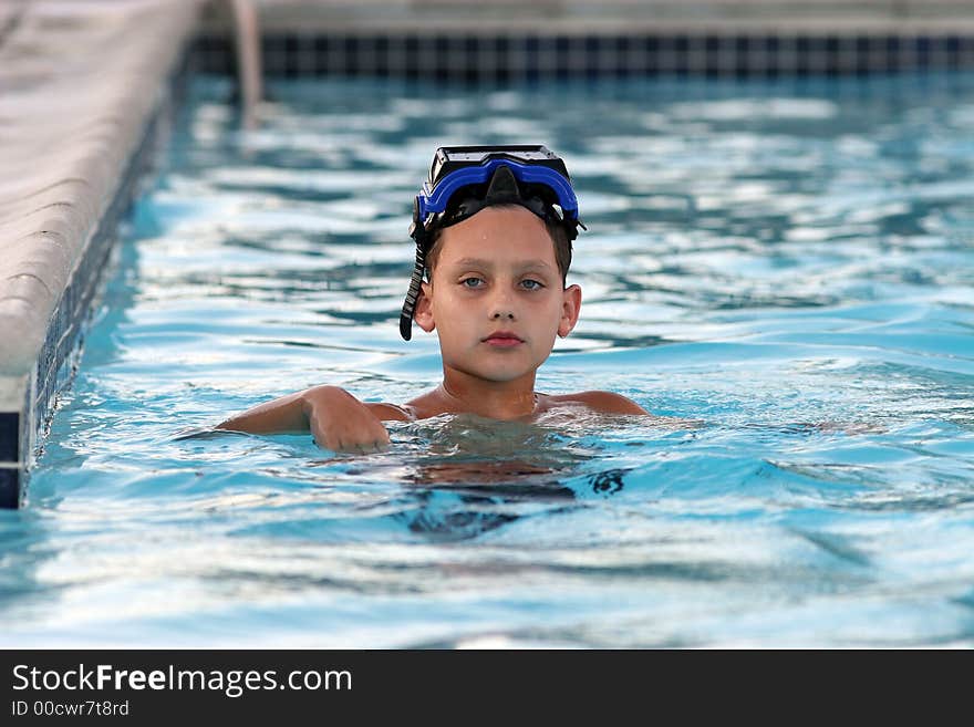 Boy Swimming In Pool