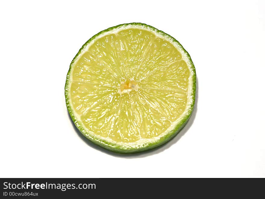 Slice of lime on white background