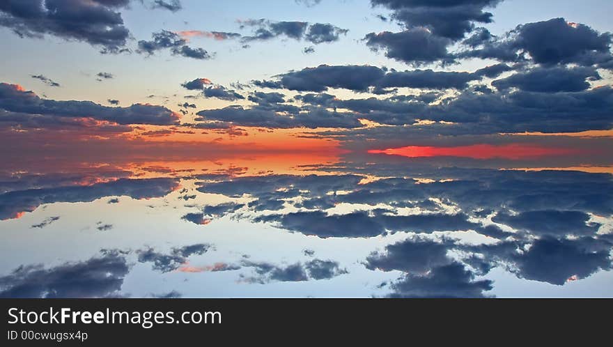 Sunset sky over calm sea. Sunset sky over calm sea