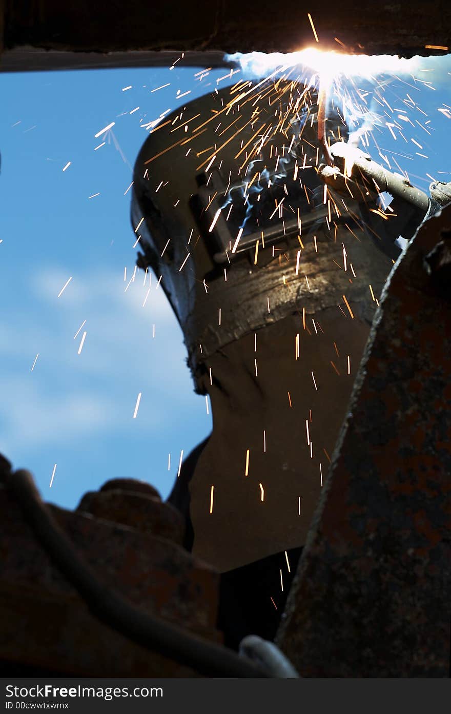 Welder working at shipyard on dayshift. Welder working at shipyard on dayshift