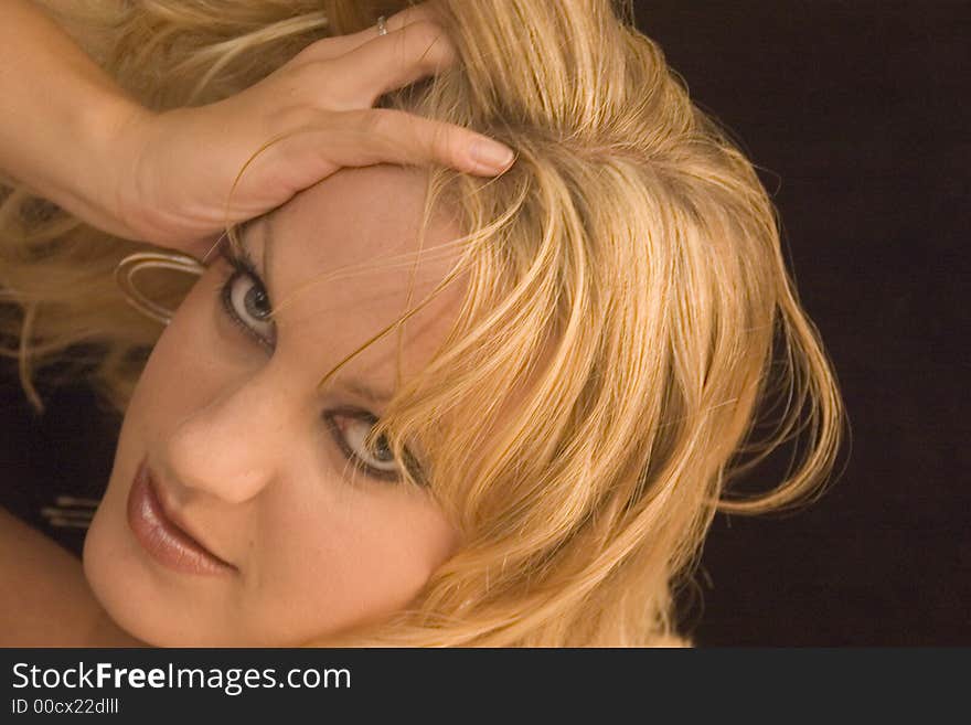 A female portrait against black background. A female portrait against black background