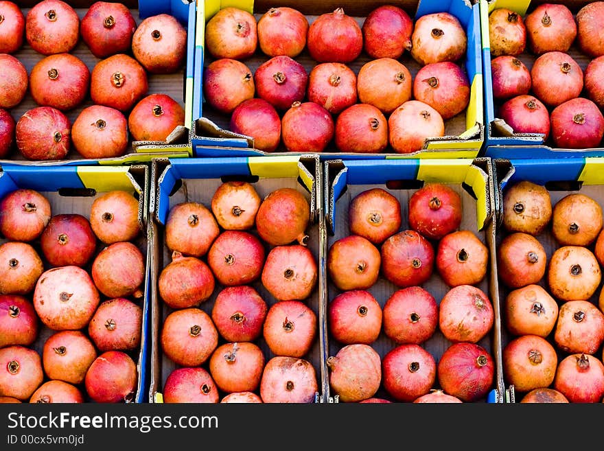 The market for farm products: fresh organic pomegranate for sale.