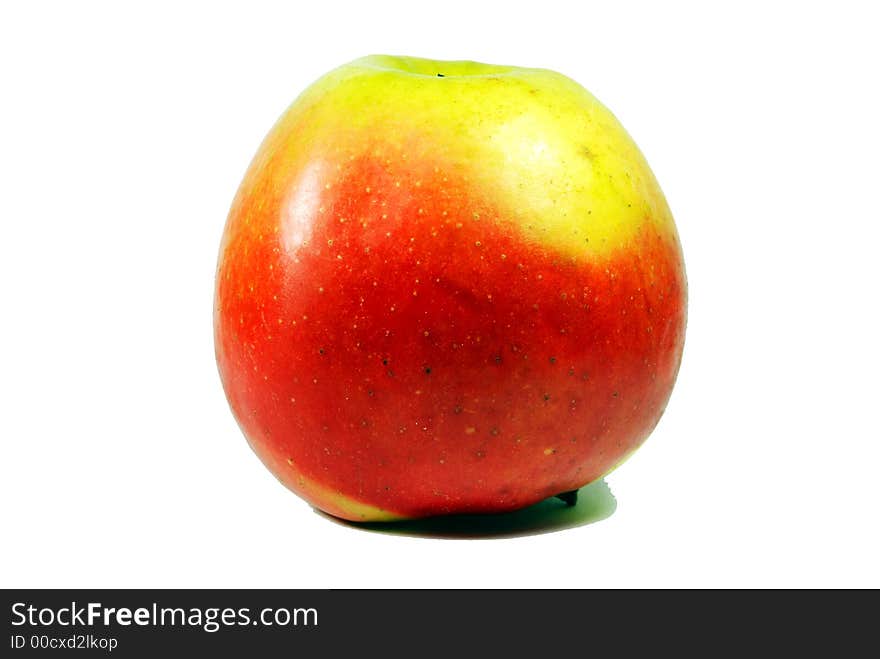 Fresh green apple with water droplets against a white background