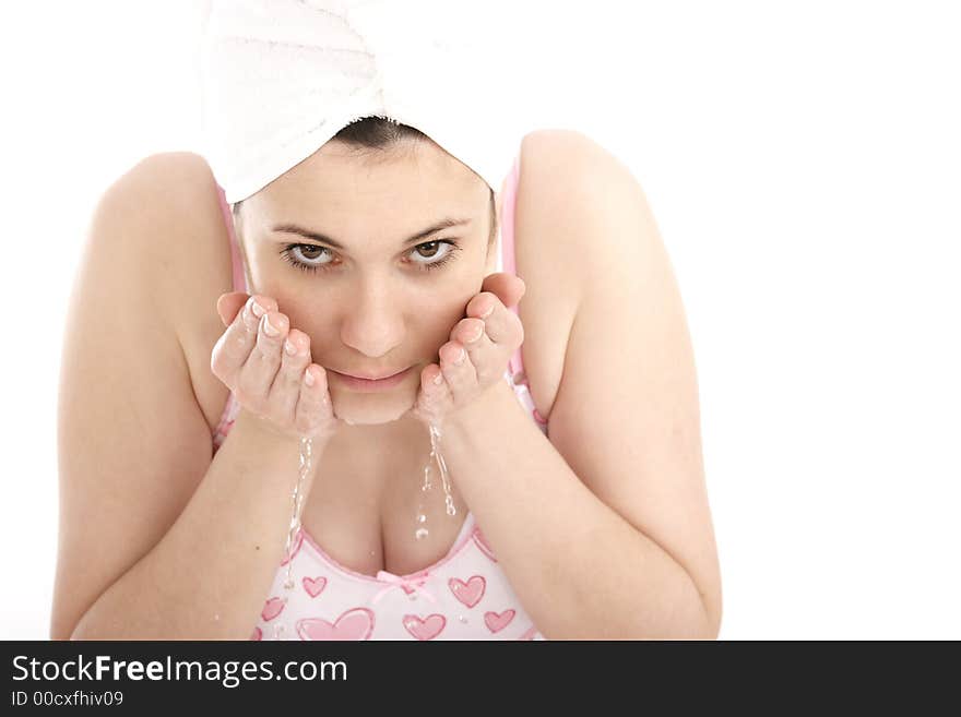 Stock Photo of Woman washing her face. Stock Photo of Woman washing her face