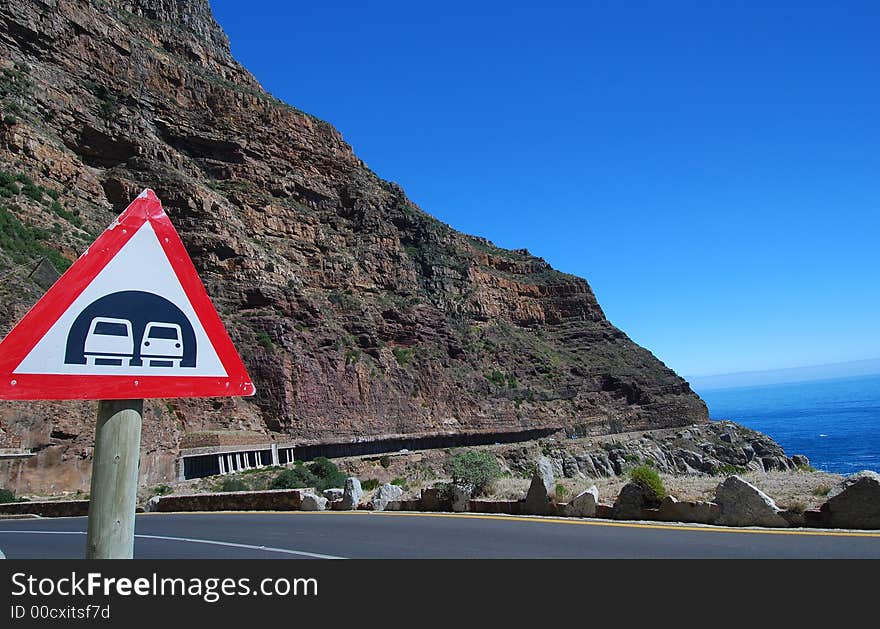 Tunnel sign on Cape Town's re-engineered Chapman's Peak drive.preventing falling rocks. Tunnel sign on Cape Town's re-engineered Chapman's Peak drive.preventing falling rocks