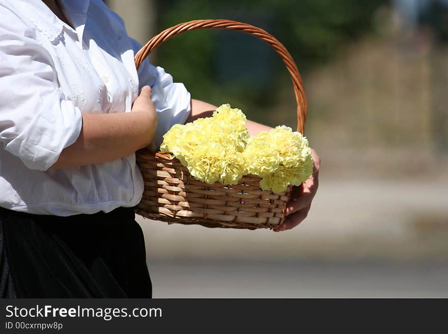 Woman with a basket with flowers