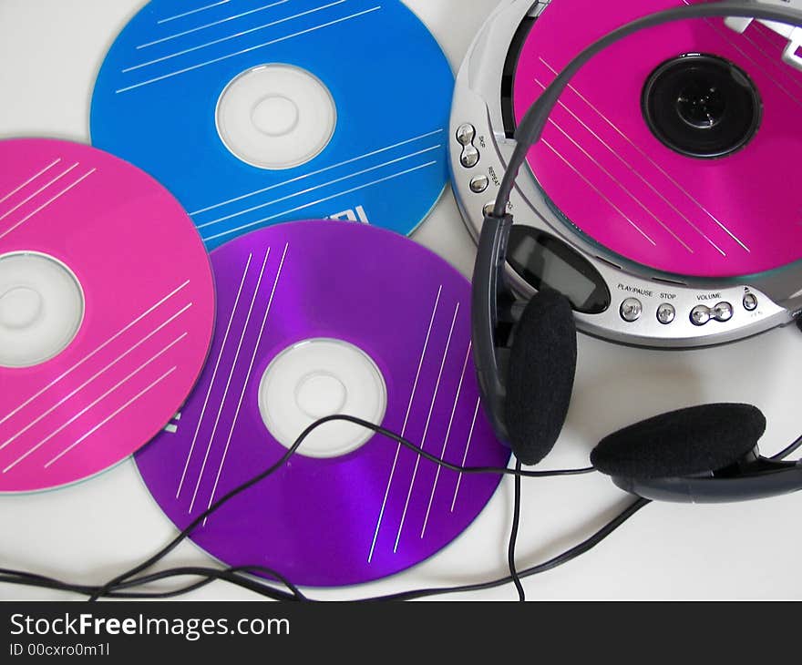 Colorful discs with a portable CD player. Colorful discs with a portable CD player