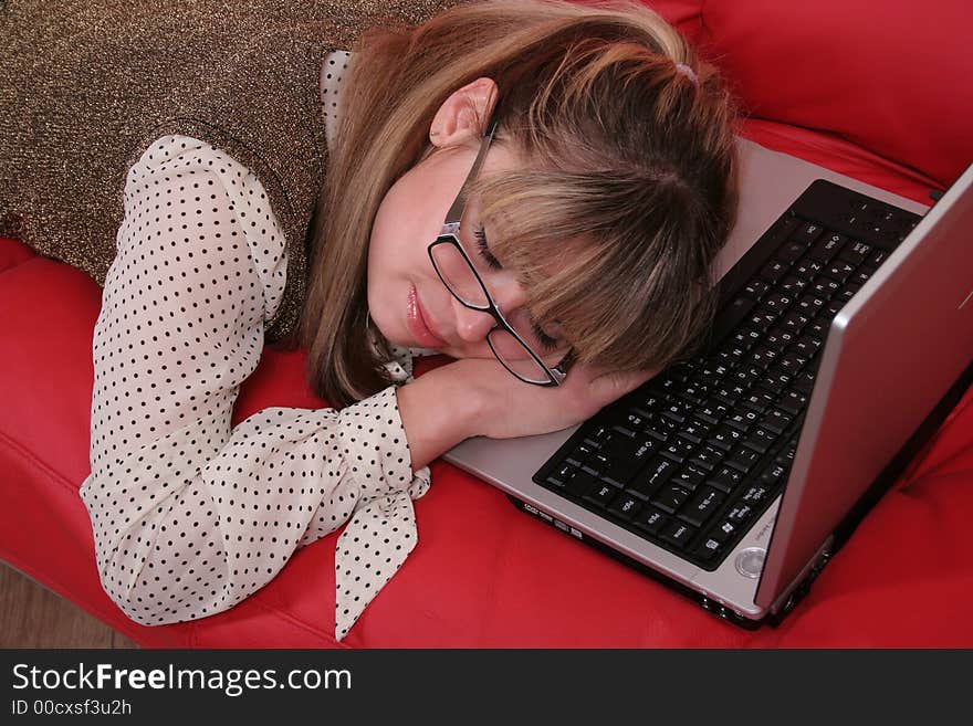 Sleeping business woman on red sofa. Sleeping business woman on red sofa