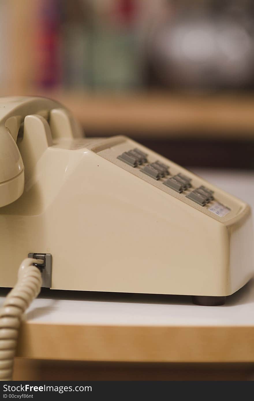 Older touch tone phone inside a home office. Older touch tone phone inside a home office.