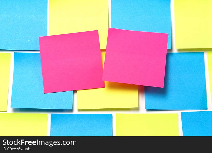 Pink Sticky Notes on Blue and Yellow