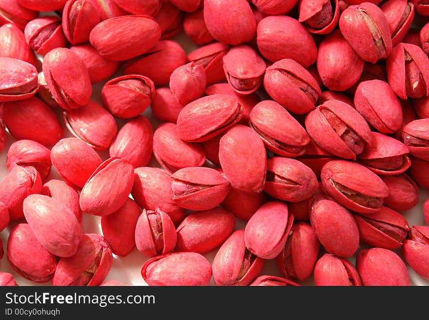 Red pistachios on a white background