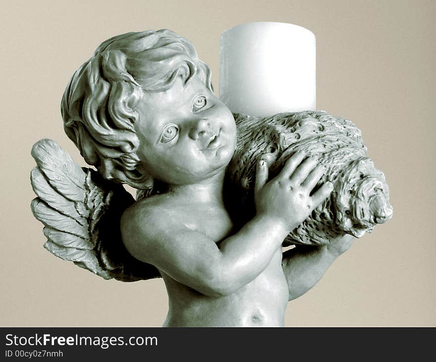 Cherub statue holding a candle. Cherub statue holding a candle