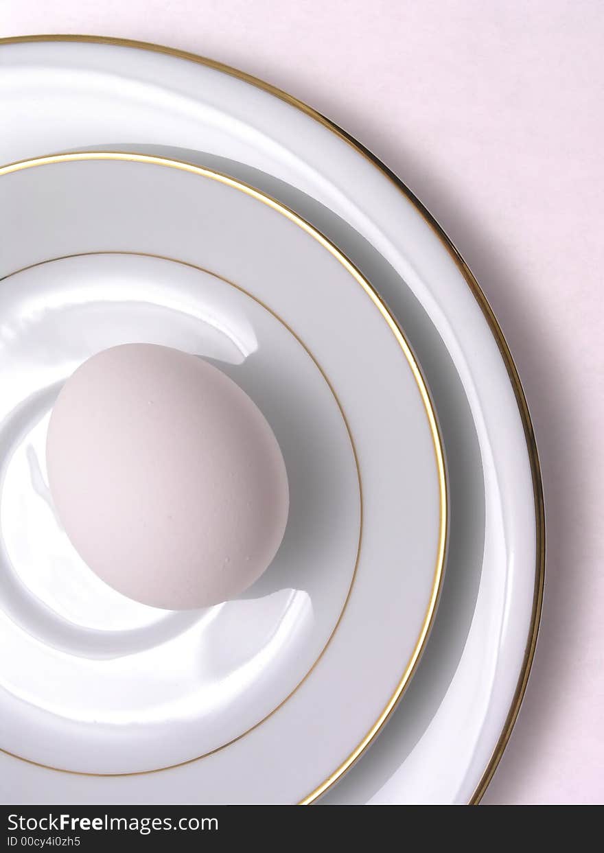 Egg on fine china saucer and plate. Egg on fine china saucer and plate