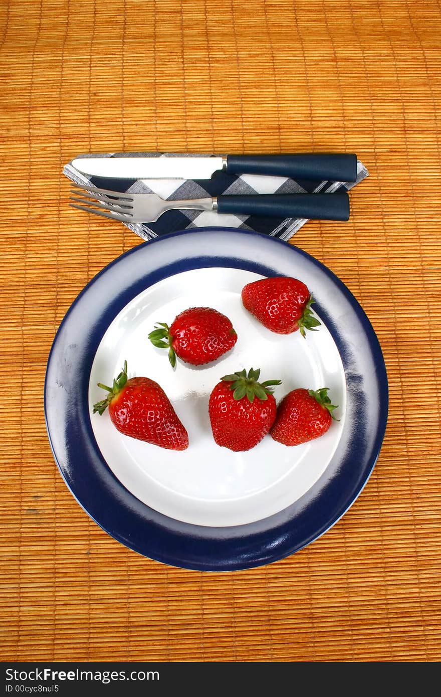 Big red strawberries on plate. Big red strawberries on plate