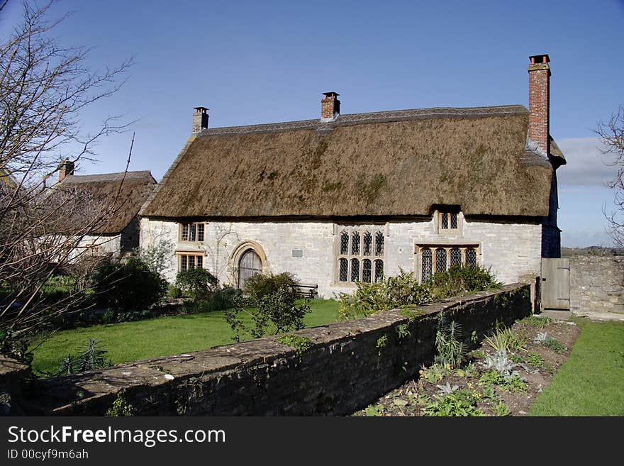 Thatched natural stone Medieval House in Rural England. Thatched natural stone Medieval House in Rural England