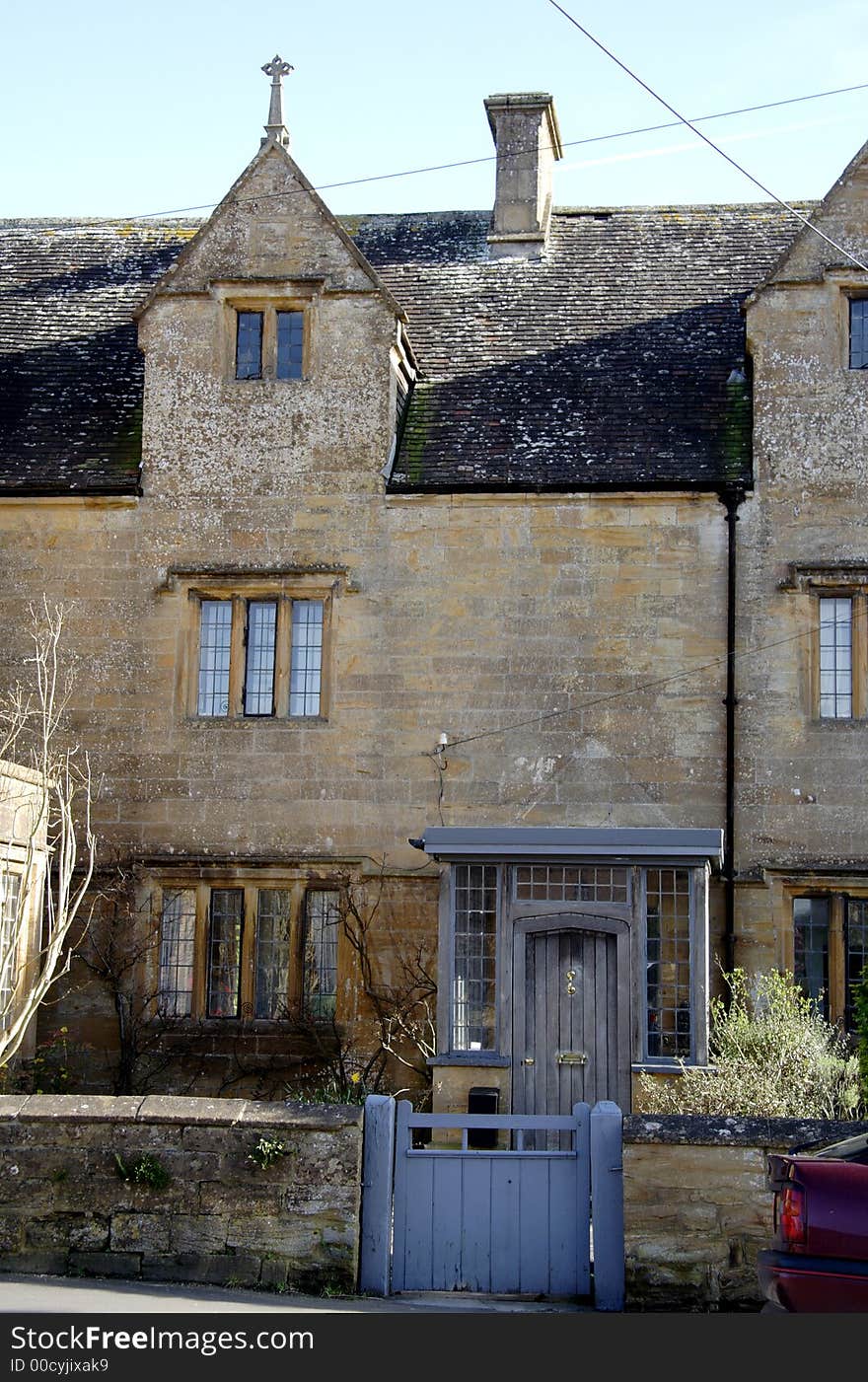 Winter sunshine on a Natural Stone Mullion windowed English Village House