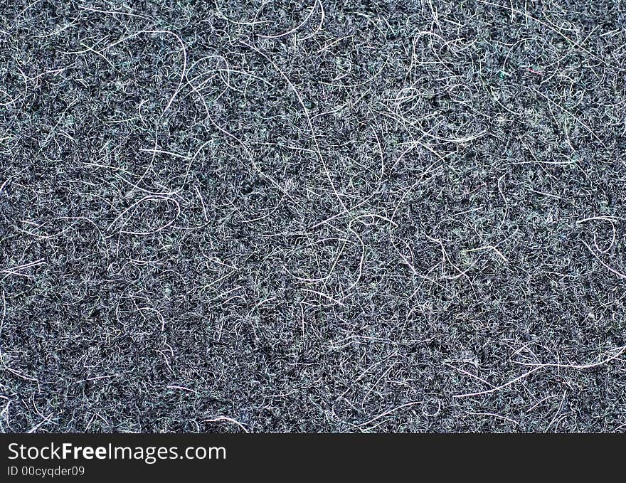 Textile background in  grey, with white hairs in close-up