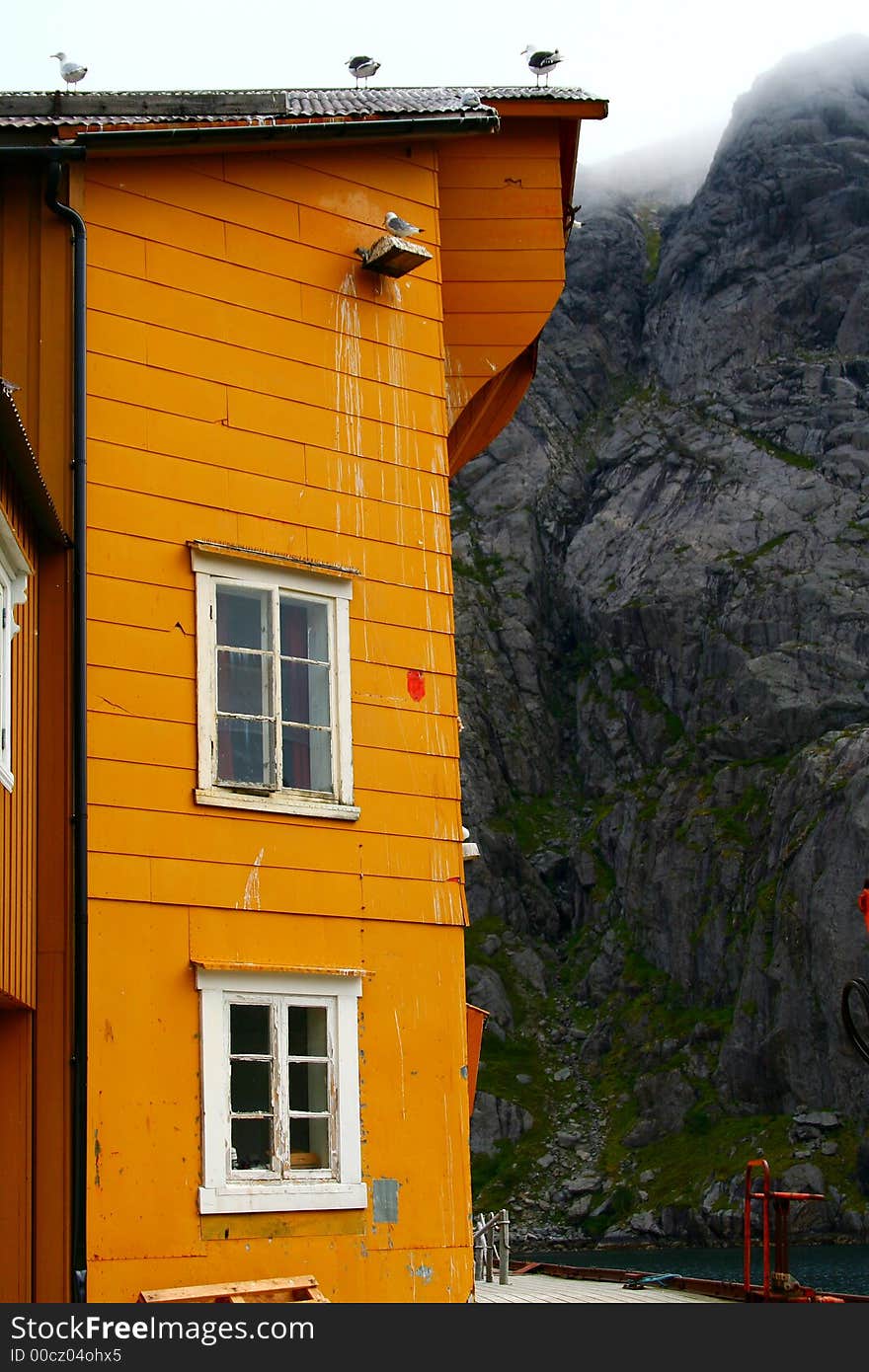 Yellow house in the a small port of the lofoten islands (norway). Yellow house in the a small port of the lofoten islands (norway)