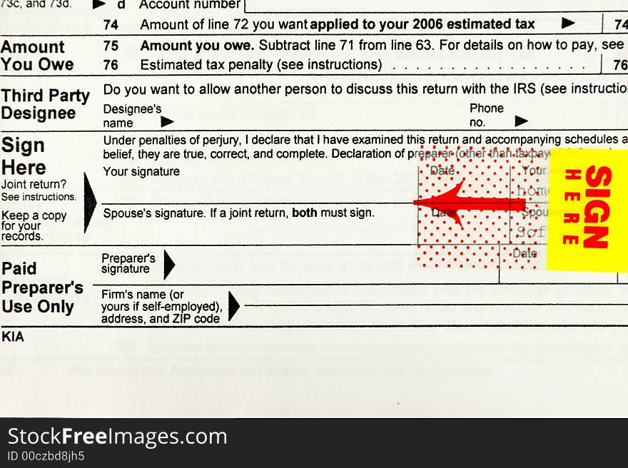 Sign here - IRS Tax form closeup