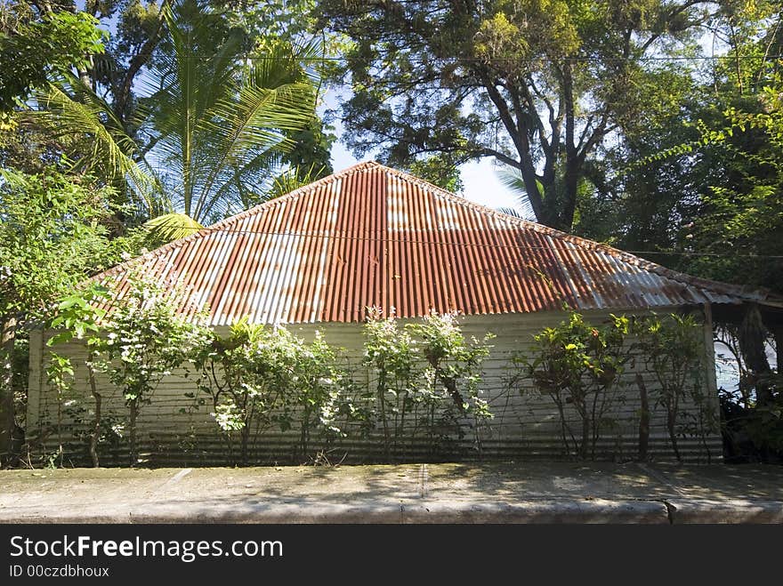 Native typical island house with tin room