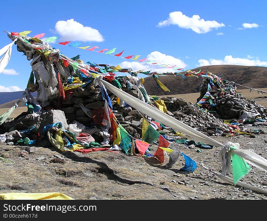 Prayerflags on top of a mountain in Tibet